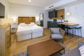 Aquitania Home Suites - Chambre