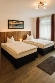 Charming Homes - Gästehaus Karin - Zimmer