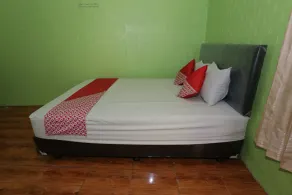 Penginapan Dison RedPartner - Chambre
