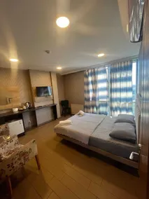 Joi Suites Hotel - Chambre