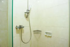 Trendy & Relaxing 2BR at The Suite Metro Apartment By Travelio - Bathroom