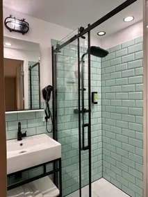 FIDSCHI'S Apartment + Hotel - Bathroom