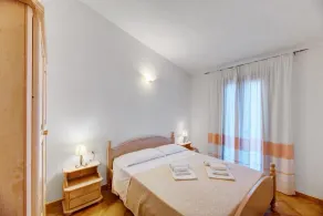 Die fantastische Residenza Badus mit zwei Schlafzimmern bietet Platz für sechs P - Zimmer