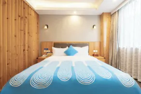 Huayi Hotel - Chambre