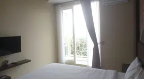 Urbanview Hotel Omah Anin Batu by RedDoorz - Chambre