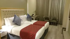 Mango Hotels Naveen - Chambre