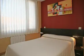 Apartamentos Playa de Portio - Chambre