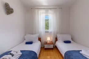 Merveilleux appartement adapté aux familles avec barbecue et piscine | Vue plage - Chambre
