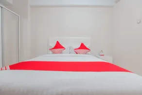 Apartemen Green Lake View Ciputat by GFROOM - Chambre