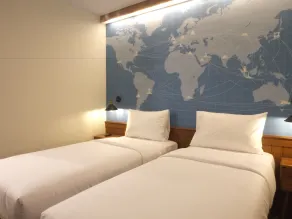 Nunia Inn Bandara Jakarta - Værelse