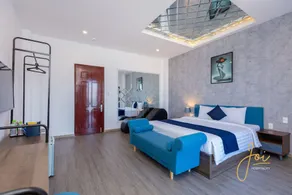 Joi Home Beachfront - Chambre