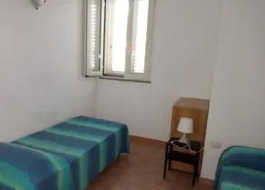 Tertenia rez-de-chaussée sud à 3 min à pied de la mer - Chambre
