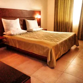 Srinivas Saffron Hotel - Room