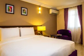 Joygate Hotel & Suites - Zimmer