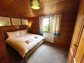 Ferienhaus mit Garten und Whirlpool | Gartenblick - Zimmer