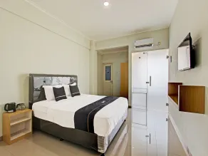 Capital O 91377 Mk Prime Syariah - Habitación