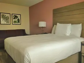 Arya Inn and Suites - Quarto