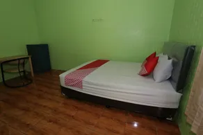 Penginapan Dison RedPartner - Chambre