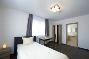 Hotel New In Guesthouse - Zimmer