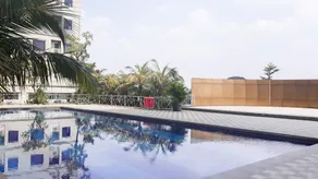 Comfort and Homey 2BR at Titanium Square Apartment By Travelio - Pool