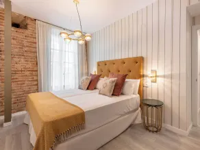 Apartamentos Puerta Elvira Suites 3000 - Værelse
