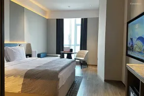 Wanda Yuehua Hotel Urumqi Railway - Chambre