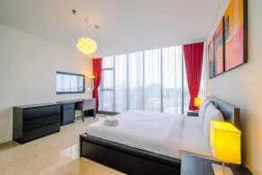 Good Deal and Strategic 1BR L'Avenue Apartment By Travelio - Habitación