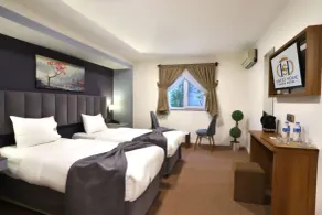 Sweet Home Suite Hotel - Vista do quarto