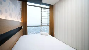Homey and Cozy Living 2BR Apartment at Aryaduta Residence Surabaya By Travelio - Habitación