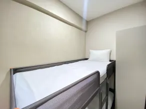 Cozy Furnished 2BR Apartment at Grand Asia Afrika By Travelio - Habitación