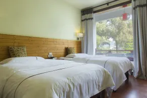 Snow Lion Riverside Resort - Chambre