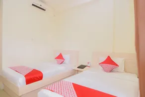 Capital O 854 Ub Caisar Hotel - Værelse