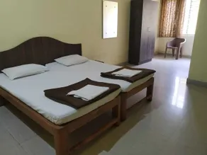 iROOMZ Hotel Vishwa Lodging - Zimmer
