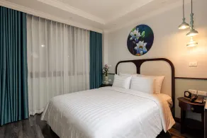 The Lotus Aman Hotel - Quarto
