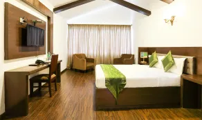 Treebo Skydale Inn & Suites With Mountain View - Habitación