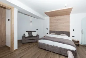 Aparthotel Familiaris - Family Apartments - Pools & Spa in Dolomites - Chambre