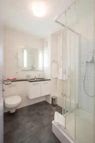 Hotel Coop Tagungszentrum & Hotelpark im Grünen - Badezimmer