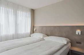 Amanthos Living Zürich Airport - Chambre