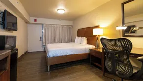 Magnuson Extended Stay and Suites Airport Hotel - Zimmer