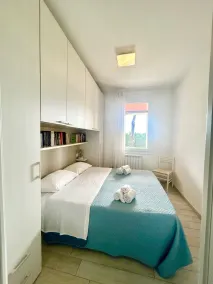 Retiro en un jardín junto al mar en Albarella - Habitación