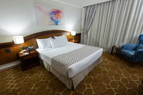 Triumph Plaza Hotel - Chambre
