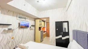 Nice and Cozy Studio at Vida View Makassar Apartment By Travelio - Chambre