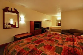 Super 6 Inn & Suites - Room