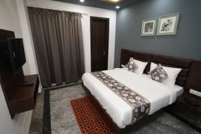 Posh Garden Inn - Vista do quarto