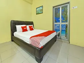 Hotel O Ummul Motel - Zimmer