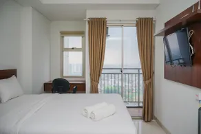 Cozy and Functional Studio Apartment at Springwood Residence - Room