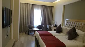Mango Hotels Naveen - Chambre