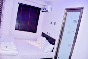 Thrivemax Hotel and Suites - Zimmer