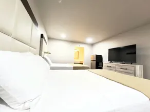 ECONOMY INN AND SUITES - Chambre