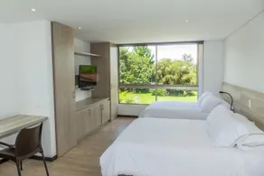MG Hotels & Suites - Room